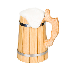 Image showing Wooden beer mug with beer isolated on white