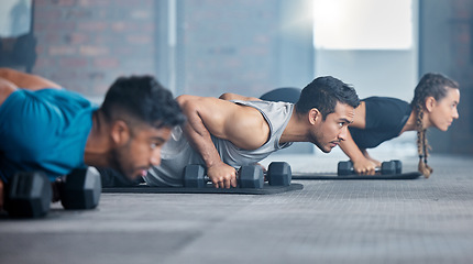 Image showing Fitness, exercise and gym with a personal trainer teaching or training a class workout in a health club. Motivation, coach and dumbbells with a man athlete and student group in a session for strength