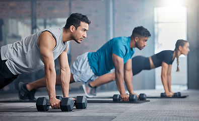 Image showing Gym, dumbbell plank and people focus on fitness diet, body health goals or performance wellness commitment. Workout motivation, class exercise challenge and athlete team training on sports club floor