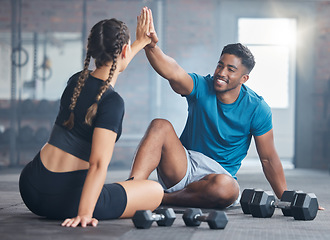 Image showing Fitness couple, high five and personal trainer with woman client to celebrate achievement, success and goal after exercise. Man and woman together at gym for partnership, health and wellness workout