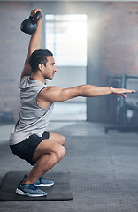 Image showing Fitness, focus and man with weights for strength training, exercise and workout in the gym. Power, strong and athlete training his body for health, motivation for goal and cardio with a squat balance