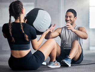 Image showing Fitness, ball and couple doing an exercise together for health, wellness and strength in the gym. Sports, healthy and strong man and woman athletes doing a workout or training in a sport center.