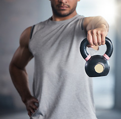 Image showing Fitness, exercise and man with kettlebell for weight training and workout for health and wellness at gym. Hand of strong athlete or bodybuilder with metal for healthy lifestyle and muscle motivation