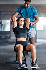 Image showing Training, weights and woman with a personal trainer for help during exercise, fitness and motivation in the gym. Health, strong and girl athlete with a coach helping with a workout at a club