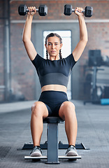 Image showing Fitness, workout and woman with dumbbells in gym training for healthcare alone. Portrait, sports and female bodybuilder or athlete weightlifting for muscle strength, power or energy at fitness center