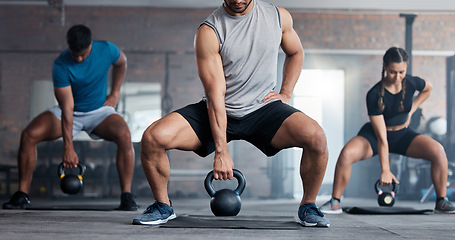 Image showing Fitness, weightlifting and kettlebell class for arm workout, exercise or training together at the gym. Active people in sports exercising with kettle weights for healthy cardio endurance or wellness