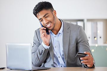 Image showing Business man, credit card and phone call for banking, ecommerce and payment for online shopping with laptop for finance work. Corporate leader talking on smartphone about fintech or investment