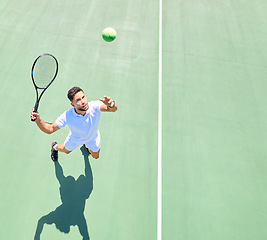 Image showing Tennis, mockup and serve with a sports man playing a game on a tennis court outoor from above. Fitness, sport and exercise with a male tennis player hitting a ball during a game or match outside