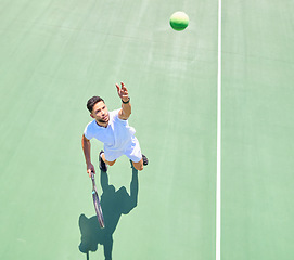 Image showing Start, above and man playing tennis on court for fitness, workout and training for a competition. Exercise, sports and professional athlete serving during a game of sport with focus in a match