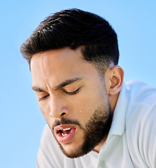 Image showing Tennis, fitness and tired man face or fatigue from exercise, cardio workout or training. Breathing, fatigue and healthy sports male relaxing or resting on a break from sports training with blue sky