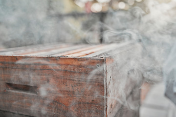 Image showing Smoke, wood box and bee farm or agriculture background for beekeeping and apiarist farming outdoor for honey, honeycomb or food. Bee smoker, equipment and natural medicine with organic beeswax