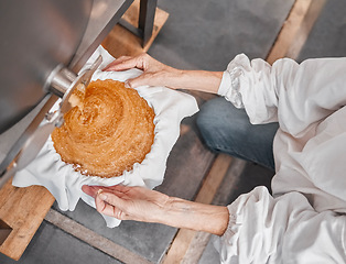 Image showing Machine, production and woman with honeycomb in factory on sustainable beekeeping farm. Industrial, workshop and lady processing sweet natural honey with manufacturing equipment in farming warehouse.