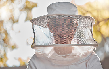 Image showing Beekeeper, woman and protective suit in portrait, happy and outddor with ppe, safety and agriculture. Senior bee farmer, happy and beekeeping at farm, backyard or nature to work in honey production