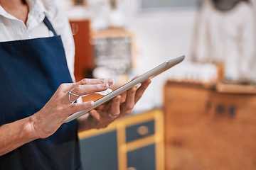 Image showing Hands, tablet and small business owner woman with e commerce, stock supply chain management and marketing for cafe. restaurant, barista and worker typing on digital technology or software network app