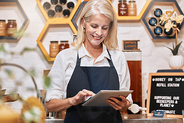 Image showing Honey business, woman entrepreneur and tablet of a female happy about small business growth. Store management employee with technology happy about organic produce sales and retail store vision