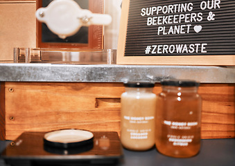 Image showing Honey, jar and small business retail or sale market, supermarket and honey jars on counter. Raw organic product, healthy farm food and nutrition healthcare support in natural grocery store