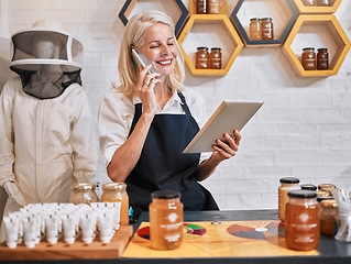 Image showing Small business woman, tablet and phone call in honey store for consulting, marketing or advertising in retail. Happy elderly female business owner working in a organic shop on phone with touchscreen