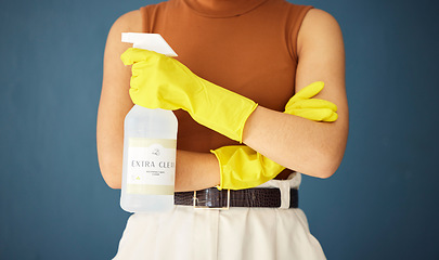 Image showing Cleaning, product and woman with organic bottle spray in studio for hygiene, fresh and eco friendly detergent on blue background. Hand, girl and cleaner to stop, prevent and protect against bacteria