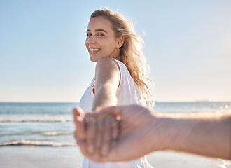 Image showing Beach, love and support with a couple holding hands on a walk, relax and happy for tropical holiday. Adventure, travel and portrait of a woman with affection, care and trust for a man by the sea