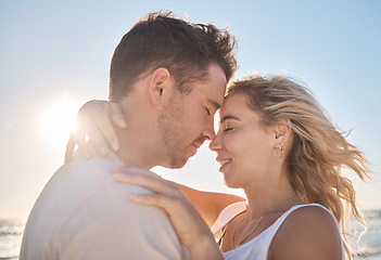 Image showing Hug, love and couple at the beach for peace, support and quality time during a holiday in Maldives. Relax, trust and man and woman on a travel vacation with affection on a date by the tropical water