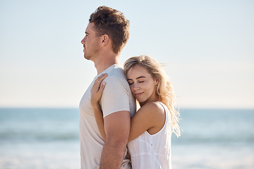 Image showing Couple, hug and love with travel to the beach and quality time together for care in relationship and bonding. Man, woman and trip to the ocean, peace and trust, support and growth with romantic date.