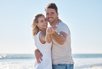 Image showing Couple, portrait smile and hug on the beach for love, care or romantic bonding together in the outdoors. Happy man and woman smiling in happiness for summer vacation or relationship romance by ocean