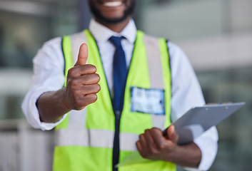 Image showing Logistics, thumbs up and clipboard for engineering, construction or architecture with black man doing inspection and quality control. Hand of engineer male showing thank you, safety and success sign