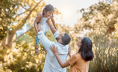 Image showing Happy family, nature and love with child, mother and father at nature park together for care, trust and support. Woman, man and lifting girl for freedom and airplane game for fun outdoor on vacation