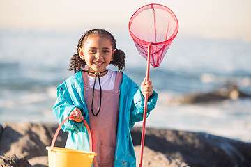 Image showing Fishing, beach and girl excited for adventure, freedom and holiday by the ocean in Australia. Equipment, happy and portrait of a child with smile to catch fish by the ocean during a vacation