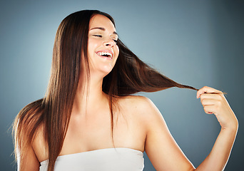 Image showing Beauty, hair and woman in hair care and cosmetic advertising, glow with shine and keratin treatment against studio background. Happy, healthy straight hair and highlights, cosmetics and wellness.