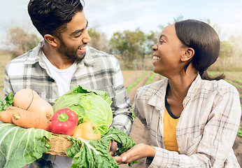 Image showing Farming, agriculture and farmers with vegetables in field happy from success in plant growth. Sustainable, teamwork and Indian man and black woman with fresh, organic and healthy produce from harvest