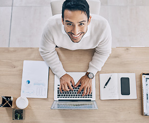 Image showing Top view, working and businessman typing on laptop doing research online, business project and writing document. Overhead, work and portrait of male worker in office with computer, notebook and phone