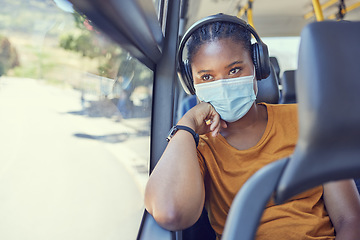 Image showing Travel, face mask and black woman with headphones on a bus driving to work during a pandemic. Public transport, covid and African girl listening to music, radio or podcast while on a journey or trip.