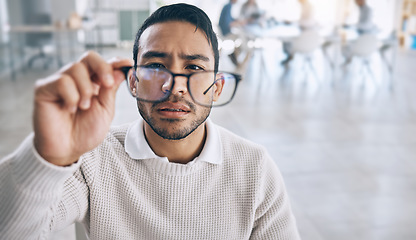 Image showing Business, vision and man with glasses to focus, improve eyesight and see in corporate workplace. Innovation, research and male worker thinking of ideas, planning and brainstorming in business meeting