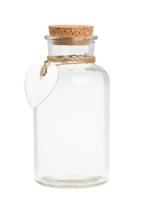 Image showing Empty vintage bottle with heart shaped label