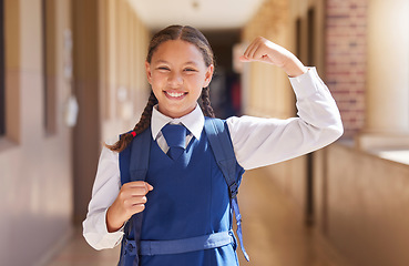 Image showing Education, school and student flexing arm for girl power, growth and development with a backpack with books. Smile, scholarship and happy child excited about learning, knowledge and future success