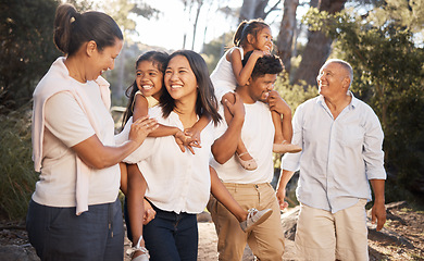 Image showing Big family walking in park, summer and freedom together in outdoor fresh air . Happy family, parents and grandparents in garden with excited kids to relax, bond and enjoy quality time, love and fun