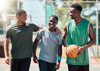 Image showing Basketball player, happy friends and walking together in conversation, training or exercise in summer. Team happiness, basketball court and basketball for black man group, outdoor or game in sunshine