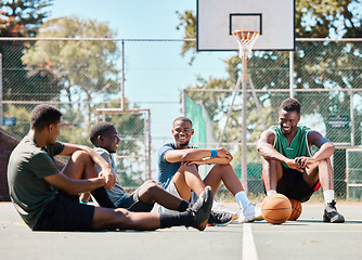 Image showing Basketball court, friends and men, break and team sports, social conversation and relax in community playground. Basketball players, rest and black people together after game, team training and match