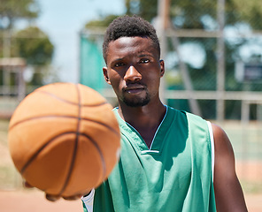 Image showing Basketball, serious face and black man ready for fitness, training and sports game outdoor. Portrait of a athlete before exercise, wellness and body health activity on playground or basketball court