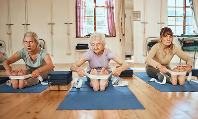 Image showing Senior, yoga stretching and leg band for wellness, training and exercise for health and gym wellness. Elderly workout and yoga class with pilates in a retirement fitness healthcare studio together