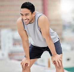 Image showing Fitness break, rest and happy man, city exercise and workout and motivation for fitness, body training and healthy lifestyle outdoors. Smile, tired and urban athlete breathing after sports challenge