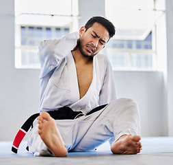 Image showing Karate, sports injury and neck pain in health gym for healthcare, medical accident and exercise training emergency. Fitness athlete, martial arts wellness and workout burnout in health club floor