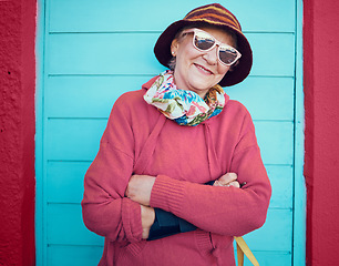 Image showing Happy, portrait and urban elderly woman on pension, retirement and holiday walk break with sunglasses. Relax, travel and happiness of senior person with smile ready to explore the city on vacation.