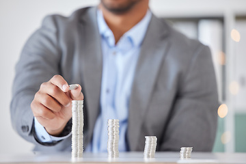 Image showing Savings, investment and finance of businessman with money counting wealth, tax or income in office. Money, economy and financial growth of corporate man at desk building coin stack in workplace.