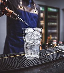 Image showing Professional bartender prepare a fresh cocktai