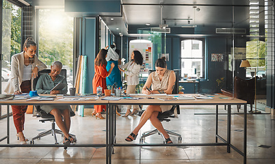 Image showing Business women, fashion designer team and office with planning and workforce at a design company. Management, working and staff in a conversation and meeting for teamwork and style strategy at desk