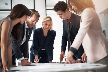 Image showing Business people, blueprint and meeting collaboration in team strategy for construction planning at office. Group of engineers in teamwork discussion, floor plan or documents for architecture project