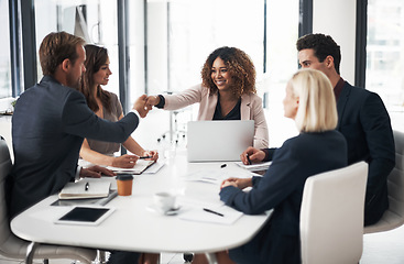 Image showing Business people, handshake and meeting for teamwork, partnership or collaboration at office conference. Happy woman shaking hands with employee in team planning, agreement or deal at the workplace