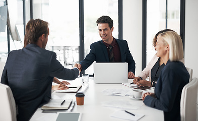 Image showing Businessman, handshake and meeting for deal, partnership or b2b in teamwork at office conference. Business people shaking hands in recruiting, hiring or deal agreement for team growth at workplace